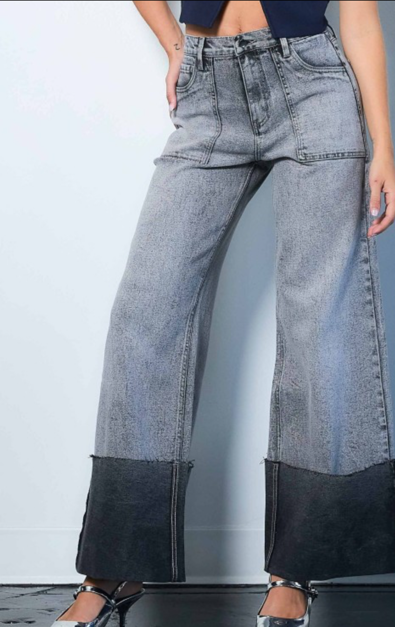 Wide-leg jeans worn by a person on a white background